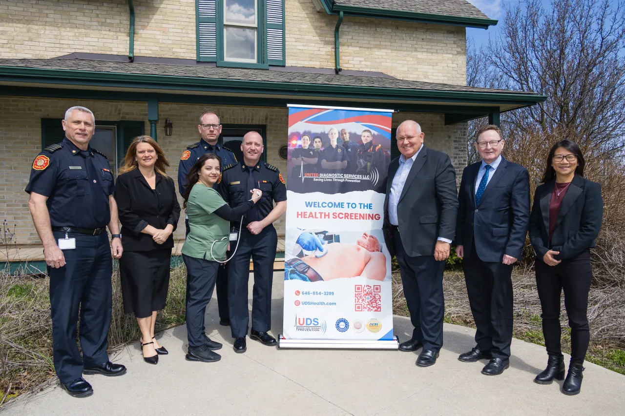 Markham Mayor and Markham Fire Chief stand next to the new On Site Fire Screen Program banner