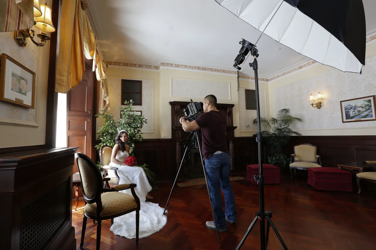 Bride being photographed.