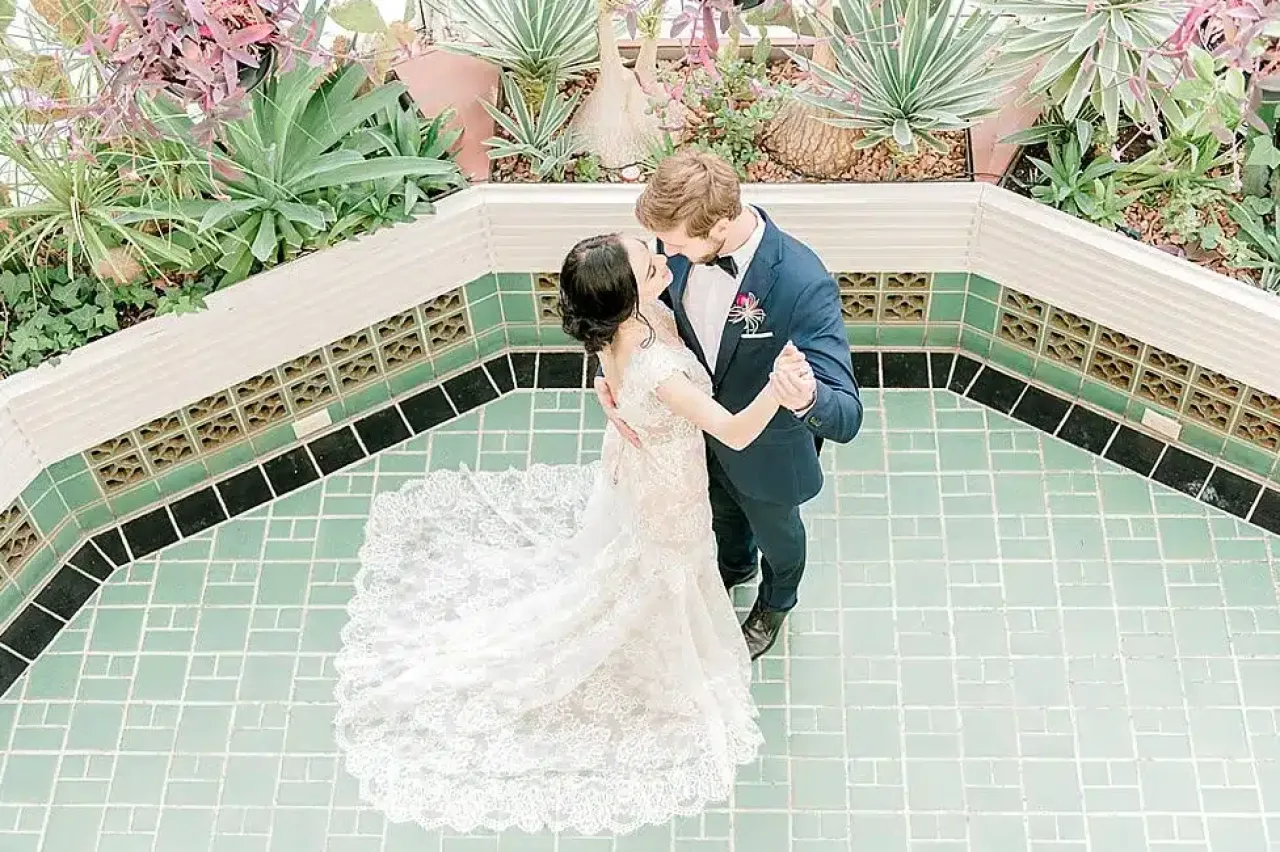 Bride and groom slow dancing in Heintzman House.
