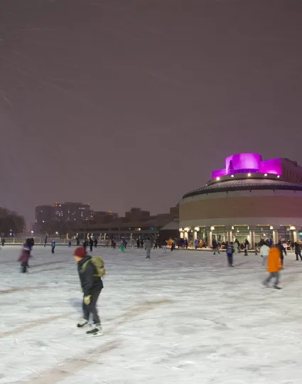 People skating on outdoor skate rink at Markham Civic Centre.