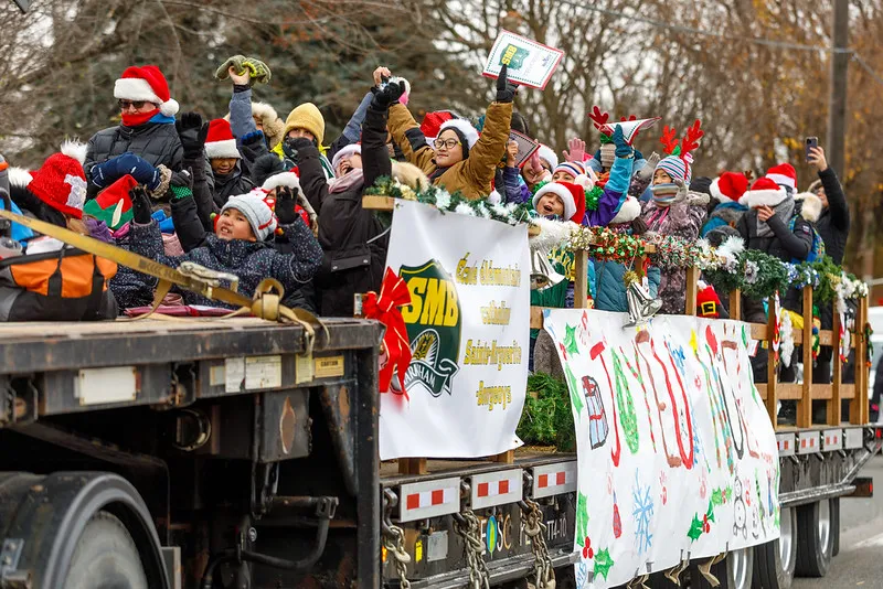 Float of people celebrating in Santa Claus parade.